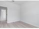 Light-filled bedroom with modern flooring and a glimpse into the adjacent room through the doorway at 55 Laurel Crse, Ocala, FL 34480