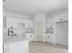 Modern kitchen with island, white cabinets, sleek countertops, stainless steel sink, and a light bright feel at 55 Laurel Crse, Ocala, FL 34480