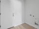 Mud room with a white door, light walls, and plenty of open space at 55 Laurel Crse, Ocala, FL 34480