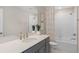 Bright bathroom featuring a modern vanity, neutral color palette and tub-shower combination at 5511 Flame Vine Way, St Cloud, FL 34771
