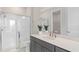 Modern bathroom featuring a glass-enclosed shower, stylish vanity, and a minimalist design at 5511 Flame Vine Way, St Cloud, FL 34771
