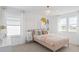 Charming bedroom featuring pastel colors, playful decor, and natural light for a cozy and inviting space at 5511 Flame Vine Way, St Cloud, FL 34771