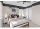 Stylish bedroom with a sleek black and white design, featuring a skateboard accent and comfortable bedding at 5511 Flame Vine Way, St Cloud, FL 34771