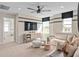 Comfortable living room with a fan, TV, and light-colored sectional sofa at 5511 Flame Vine Way, St Cloud, FL 34771