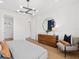 A bedroom featuring wood-look floors and a modern light fixture at 5517 Flame Vine Way, St Cloud, FL 34771