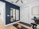 Spacious exercise room with hardwood floors, a wall mirror, and a double door closet at 5517 Flame Vine Way, St Cloud, FL 34771