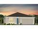 Charming single-story home with a two-car garage and landscaped front yard at sunset at 5517 Flame Vine Way, St Cloud, FL 34771