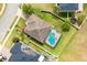 Aerial view of a home with a beautiful in-ground pool and spa inside a screened enclosure at 563 Copperdale Ave, Winter Garden, FL 34787