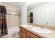 This bright bathroom features double sinks, a large mirror and a shower-tub combo at 563 Copperdale Ave, Winter Garden, FL 34787