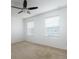 Bedroom featuring a ceiling fan, neutral carpet, and a pair of windows at 563 Copperdale Ave, Winter Garden, FL 34787