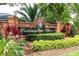 Elegant brick sign for Covington Chase community, surrounded by lush landscaping and greenery at 563 Copperdale Ave, Winter Garden, FL 34787