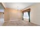 Comfortable dining room with carpet floors and chandelier at 563 Copperdale Ave, Winter Garden, FL 34787