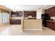 Kitchen with dark cabinets and modern appliances at 563 Copperdale Ave, Winter Garden, FL 34787