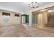 Spacious living room with carpet floors, chandelier and staircase at 563 Copperdale Ave, Winter Garden, FL 34787