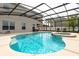 Enjoy this beautiful in-ground pool inside a screened enclosure with an adjoining spa and plenty of room for seating at 563 Copperdale Ave, Winter Garden, FL 34787