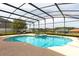 Enjoy this beautiful in-ground pool inside a screened enclosure with an adjoining spa and plenty of room for seating at 563 Copperdale Ave, Winter Garden, FL 34787