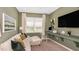 Comfortable bonus room/den with ample natural light, ideal for a home office at 5646 Ficus Aurea St, Kissimmee, FL 34758