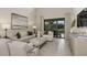 Bright living room with sliding glass doors to the patio overlooking the outdoor living area at 5646 Ficus Aurea St, Kissimmee, FL 34758