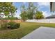 Large backyard with a privacy fence and lush greenery at 7602 Glenmoor Ln, Winter Park, FL 32792