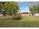 Private backyard featuring a privacy fence and garden area at 7602 Glenmoor Ln, Winter Park, FL 32792