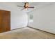 Bedroom with a window, ceiling fan, and a door at 7602 Glenmoor Ln, Winter Park, FL 32792