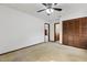 Comfortable bedroom offers carpet flooring, ceiling fan, and convenient access to other rooms at 7602 Glenmoor Ln, Winter Park, FL 32792