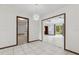 Bright dining room featuring smooth tile floors and seamless access to adjacent living areas at 7602 Glenmoor Ln, Winter Park, FL 32792