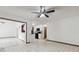 Inviting living area adjacent to the kitchen featuring tile flooring and pass-through window at 7602 Glenmoor Ln, Winter Park, FL 32792
