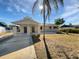 Inviting single-story home with a covered entrance, a well-maintained yard, and ample parking space at 800 Marion Dr, Mount Dora, FL 32757