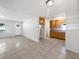Open-concept space featuring tiled floors connecting the living area to the kitchen at 800 Marion Dr, Mount Dora, FL 32757