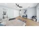 Serene bedroom with natural light, modern decor, and access to a private bath at 8143 Britt Dr, Orlando, FL 32822