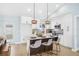 Modern kitchen featuring a center island with bar seating and stainless steel appliances, with outdoor access at 8143 Britt Dr, Orlando, FL 32822