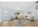 Comfortable living room featuring modern decor, a large window, and a cozy seating arrangement at 8143 Britt Dr, Orlando, FL 32822