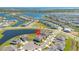 Stunning aerial view of a lakeside community highlighting the property's prime location near the water at 13231 Panama Beach Ct, Orlando, FL 32827