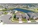 Aerial view of a community with large houses, beautiful blue lakes, and well-manicured landscaping at 13231 Panama Beach Ct, Orlando, FL 32827