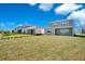 A serene backyard features lush lawn space, ideal for outdoor activities and relaxation at 13231 Panama Beach Ct, Orlando, FL 32827