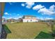A sprawling backyard with verdant lawn offers endless possibilities for landscaping and outdoor enjoyment at 13231 Panama Beach Ct, Orlando, FL 32827