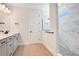 Modern bathroom featuring a glass shower door and neutral tile at 13231 Panama Beach Ct, Orlando, FL 32827