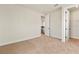 A cozy bedroom with neutral carpet and walls, offering a blank canvas for personalization and comfortable living at 13231 Panama Beach Ct, Orlando, FL 32827