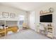 ' bedroom with bunk beds, a desk, a mounted TV, and shelves with cute decorations at 13231 Panama Beach Ct, Orlando, FL 32827