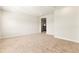 Upstairs bonus room has neutral colored carpet and white walls at 13231 Panama Beach Ct, Orlando, FL 32827
