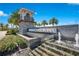 Elegant community entrance features stone accents, a charming tower, and cascading water features, offering a grand welcome at 13231 Panama Beach Ct, Orlando, FL 32827