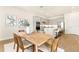 Open concept dining area and kitchen with grey cabinets, stainless appliances, and seating for 6 at 13231 Panama Beach Ct, Orlando, FL 32827