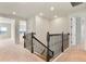 Upstairs hallway features neutral carpet, white walls, and decorative wrought iron railings with access to multiple rooms at 13231 Panama Beach Ct, Orlando, FL 32827