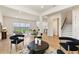 Open-concept living room with tile flooring, contemporary furniture, and views of the backyard at 13231 Panama Beach Ct, Orlando, FL 32827