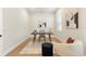 Home office with a neutral color scheme, modern desk, art, and accent chair at 13231 Panama Beach Ct, Orlando, FL 32827