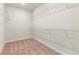 The walk-in closet features wire shelving with neutral colored carpet at 13231 Panama Beach Ct, Orlando, FL 32827