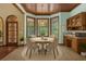 Bright dining area featuring bay windows, a cozy dining set, and a serving station at 1626 Wood Duck Dr, Winter Springs, FL 32708