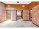 Spacious living room with brick walls and light carpet, offering a unique and inviting atmosphere at 1626 Wood Duck Dr, Winter Springs, FL 32708