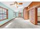 Bright living room with unique brick wall, windows, skylight, and light blue colored walls at 1626 Wood Duck Dr, Winter Springs, FL 32708